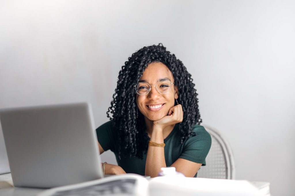 Web-design-professional-excited-and-focused-as-she-builds-a-website-for-Boost-Web-Solutions
